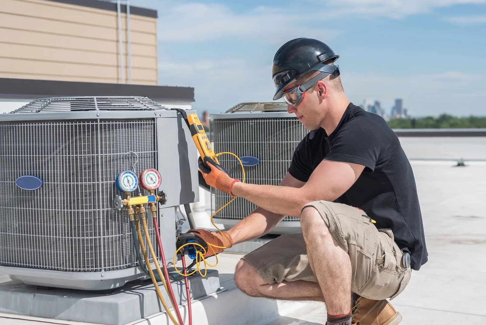 HVAC technician working on heating and cooling equipment